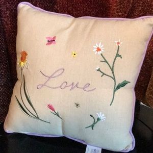 Small embroidered “love” accent pillow.